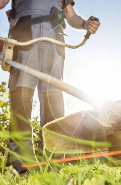 Man using a line trimmer.